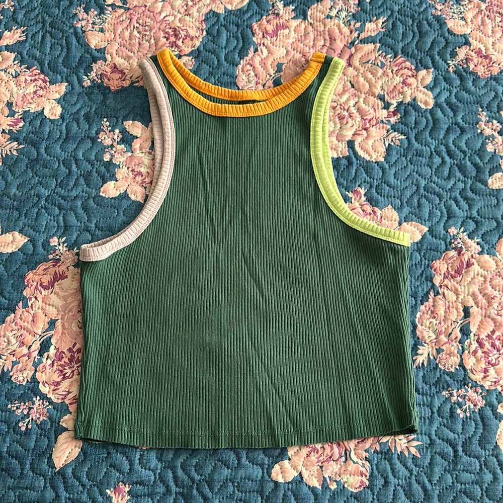 This is a Green cropped tank top with purple, orange and like green outline.